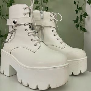 White platform boots with silver chain